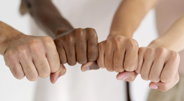 close_up_people_connecting_through_hands